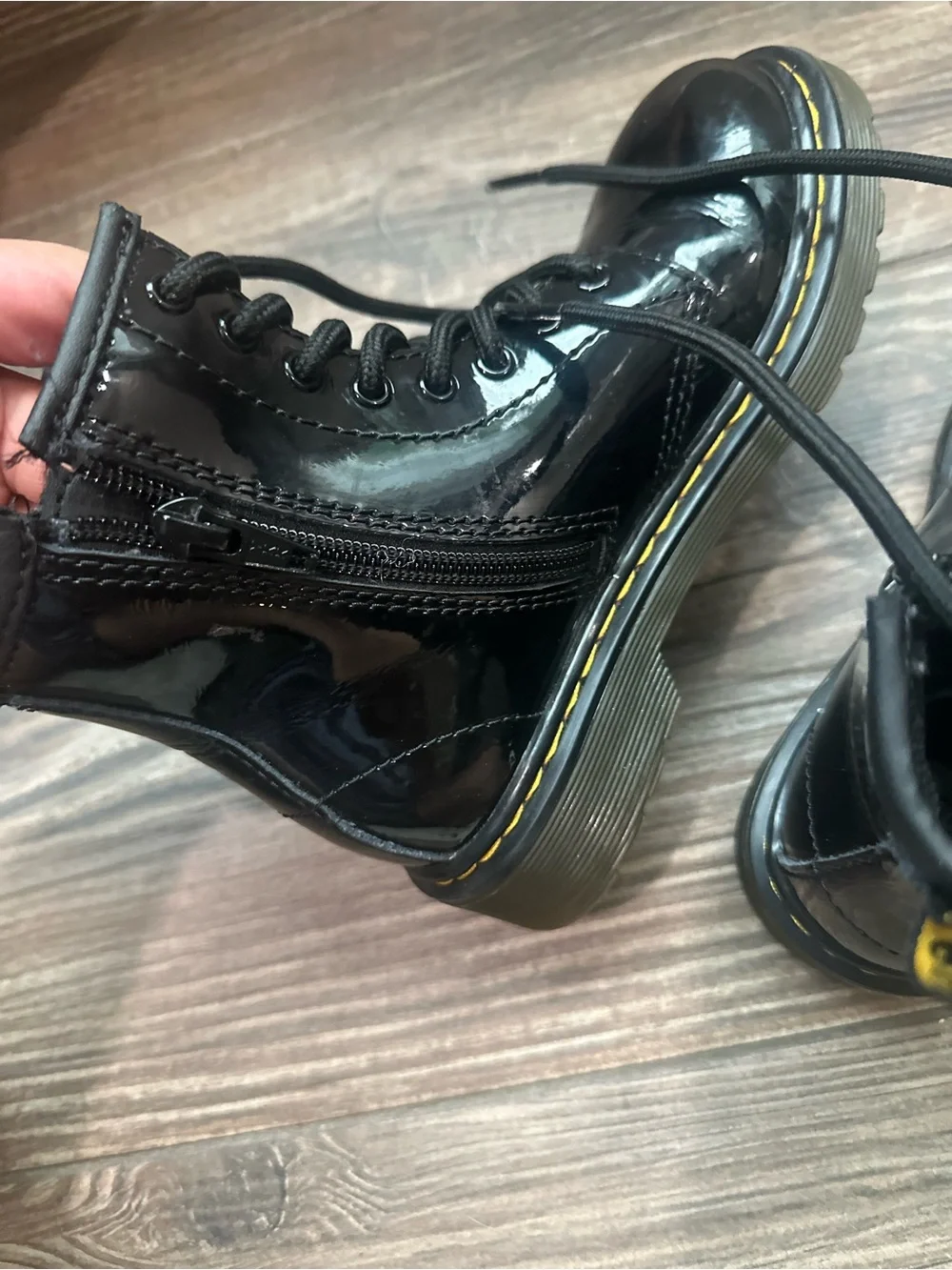 Dr. Martens Kids Black Patent Lace-Up Combat Boots with Yellow Heel Loop
